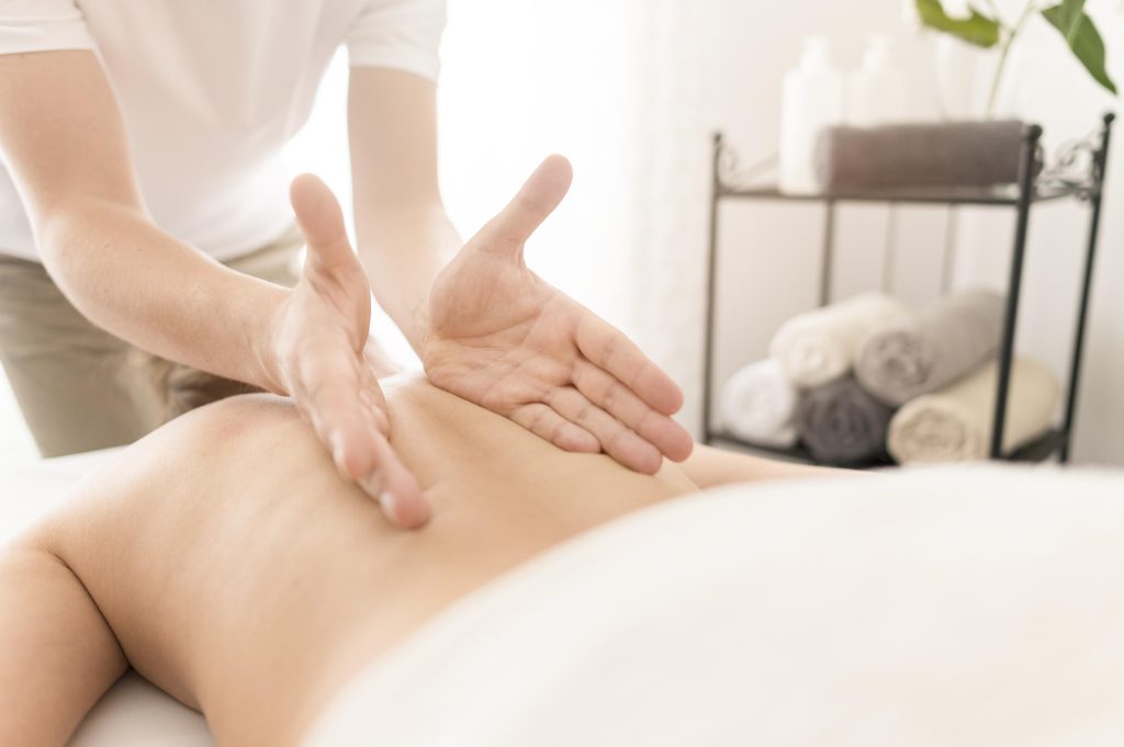 close up man massaging client