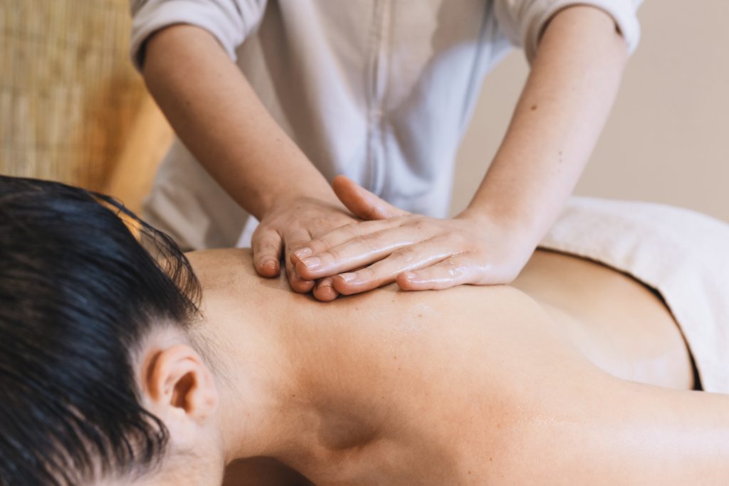 massage concept with relaxed woman
